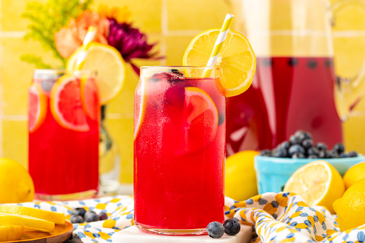 Glasses of blueberry lemonade on a table