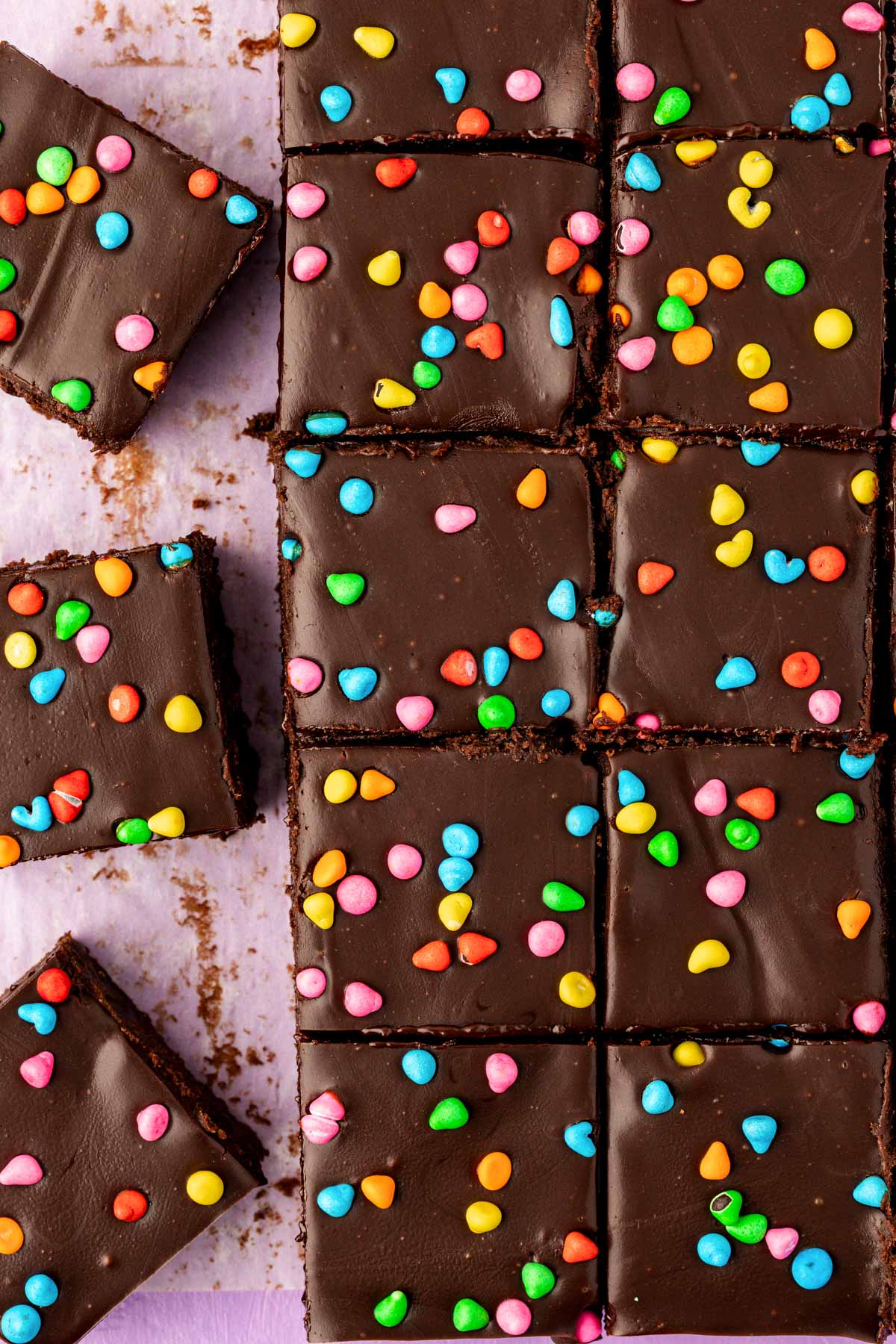 Homemade cosmic brownies sliced on a table.