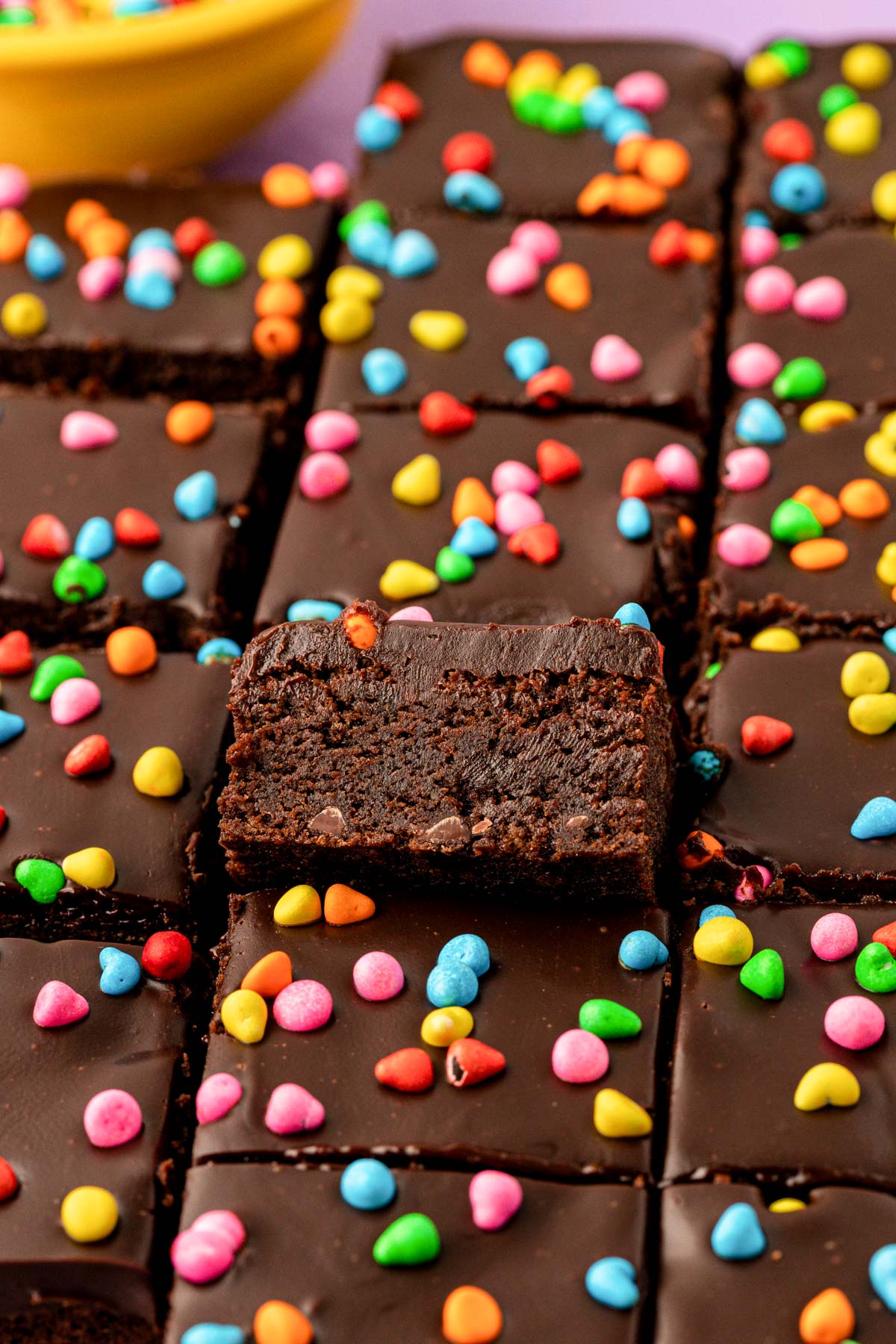 Cosmic brownies that are homemade, cut on a table.