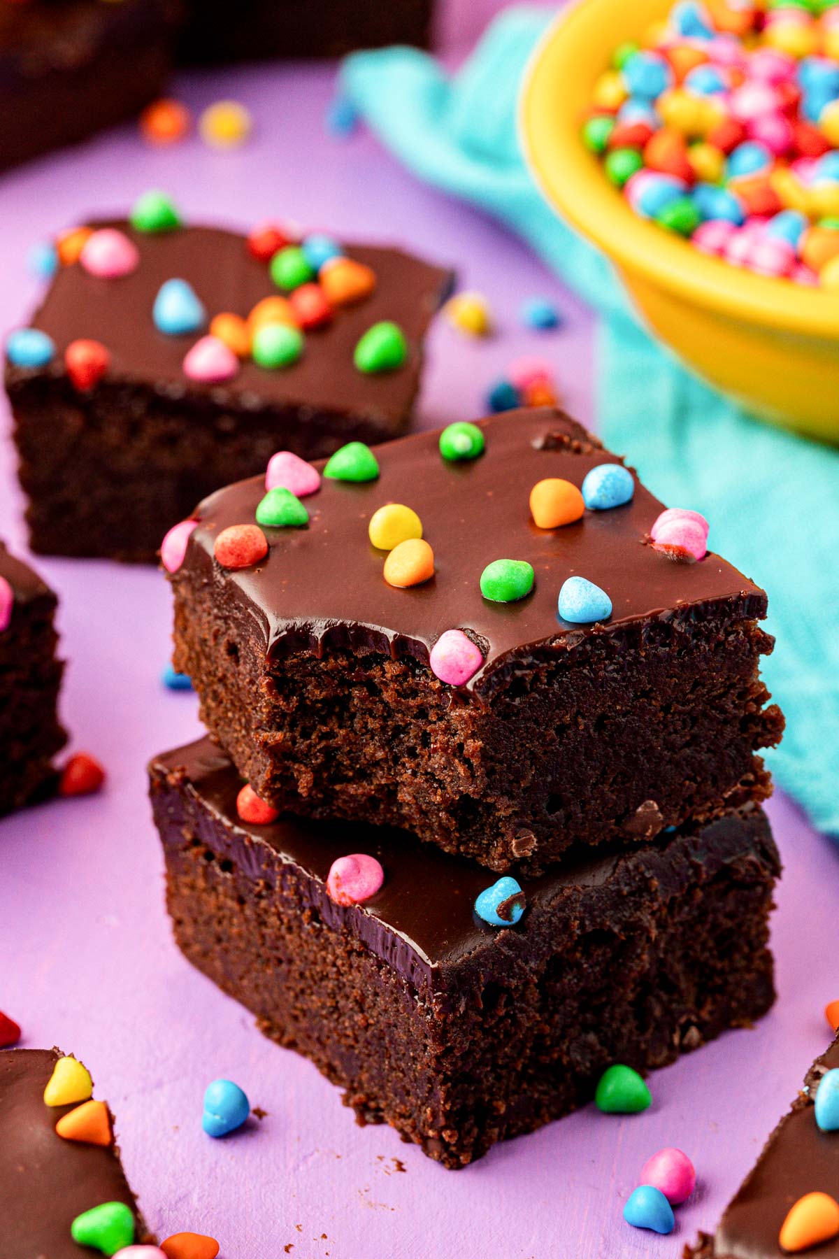 Close up of two cosmic brownies stacked with the top one missing a bite.