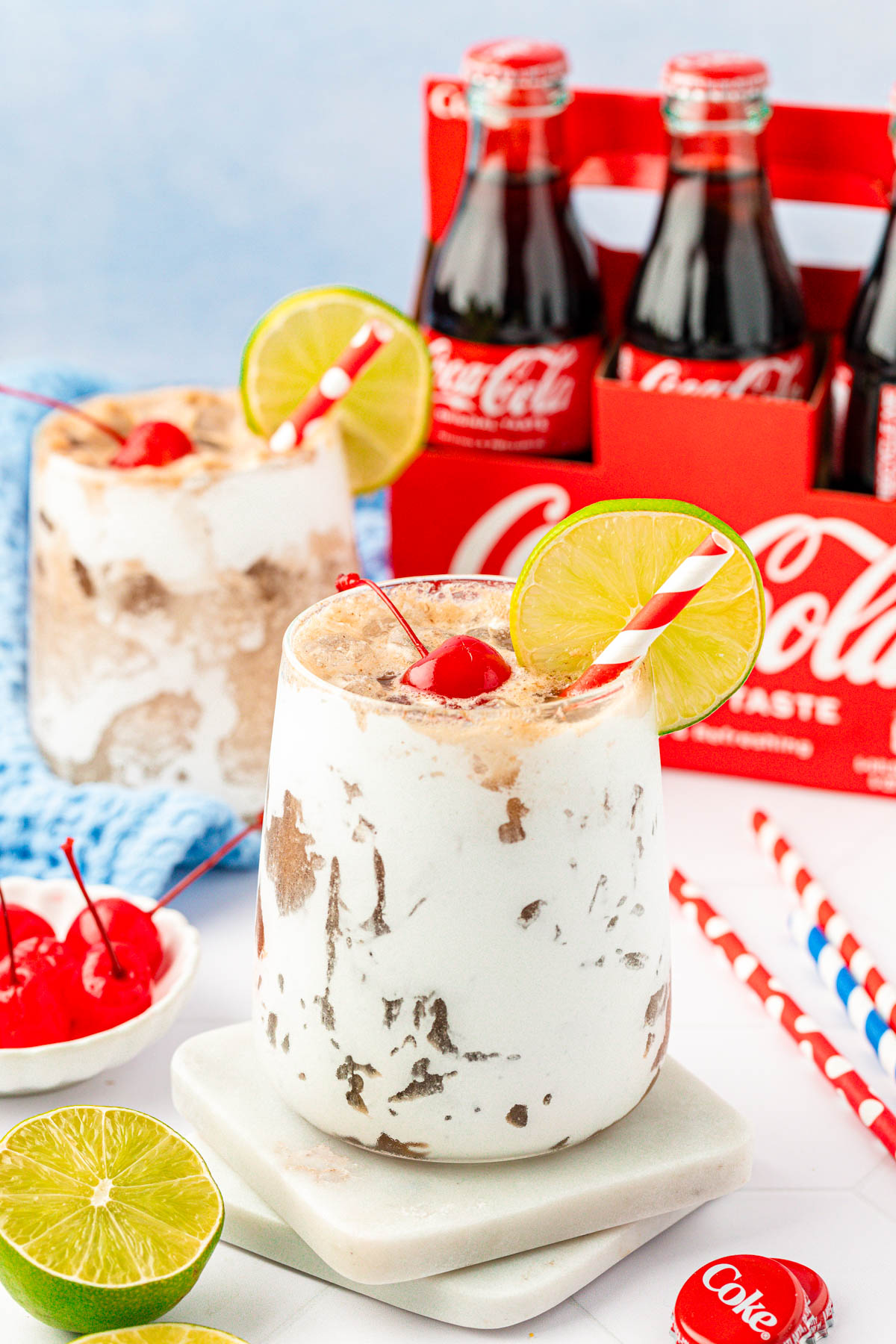 Close up of a Fluffy Coke on a marble coaster.