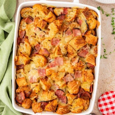 Overhead photo of a casserole made with ham, cheese, and croissants.