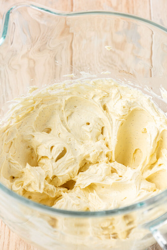 Frosting in a glass mixing bowl.