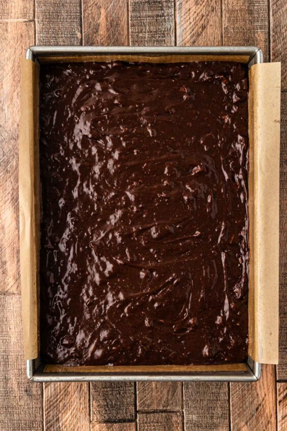 Brownie batter in a 9x13-inch pan ready to bake.