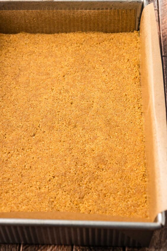 Graham cracker crust in a pan.