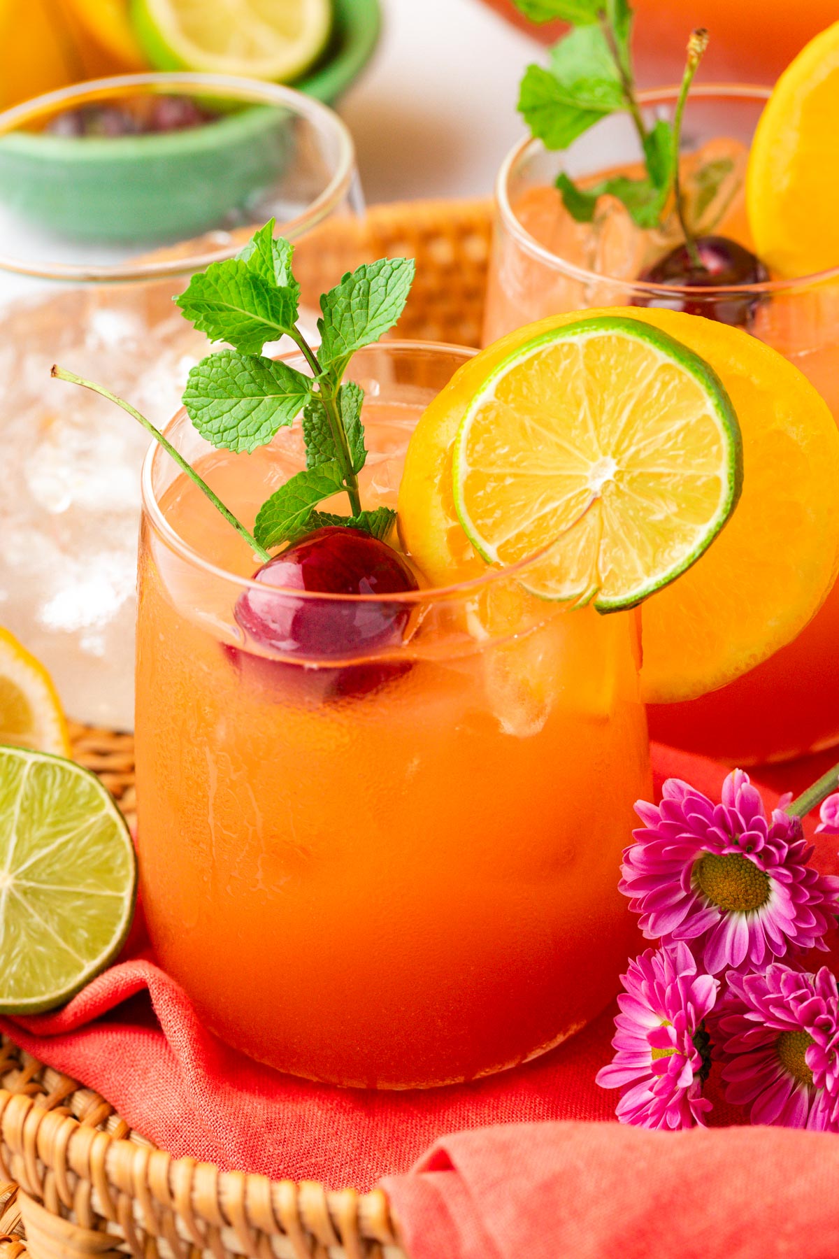 A glass filled with summer party punch on a tray.