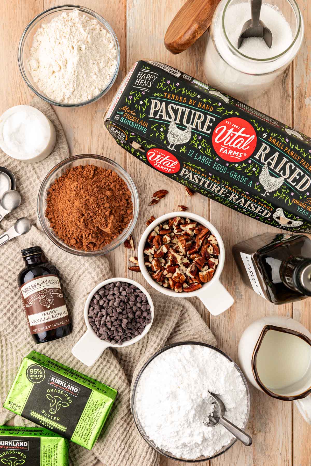 Overhead photo of ingredients to make Texas Sheet Cake brownies on a wooden table.