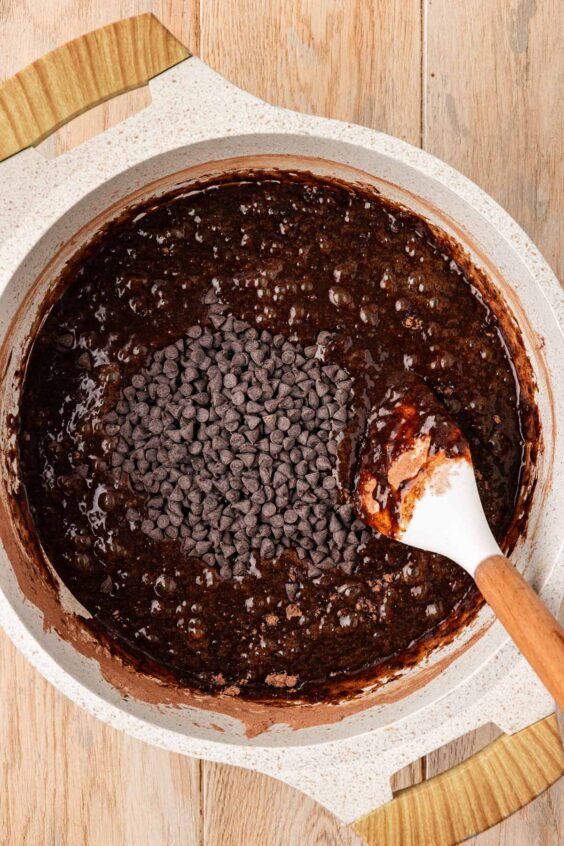 Mini chocolate chip in a pot of brownie batter.