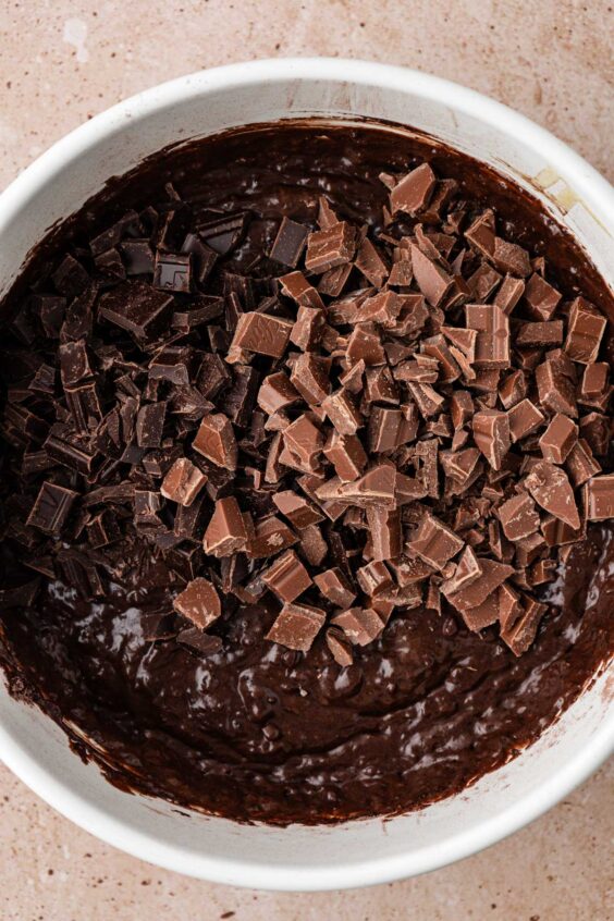 Chopped chocolate ready to be folded into chocolate muffin batter.