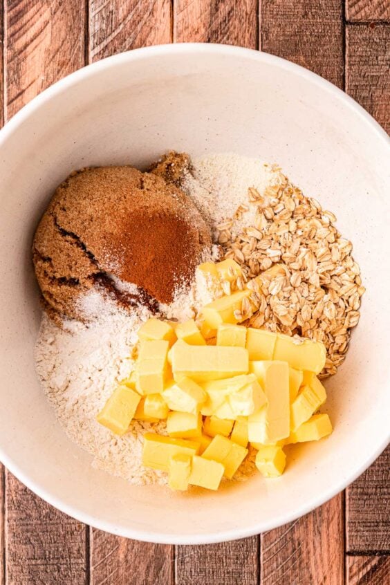 Ingredients to make crisp topping for apple crisp in a bowl ready to be mixed.