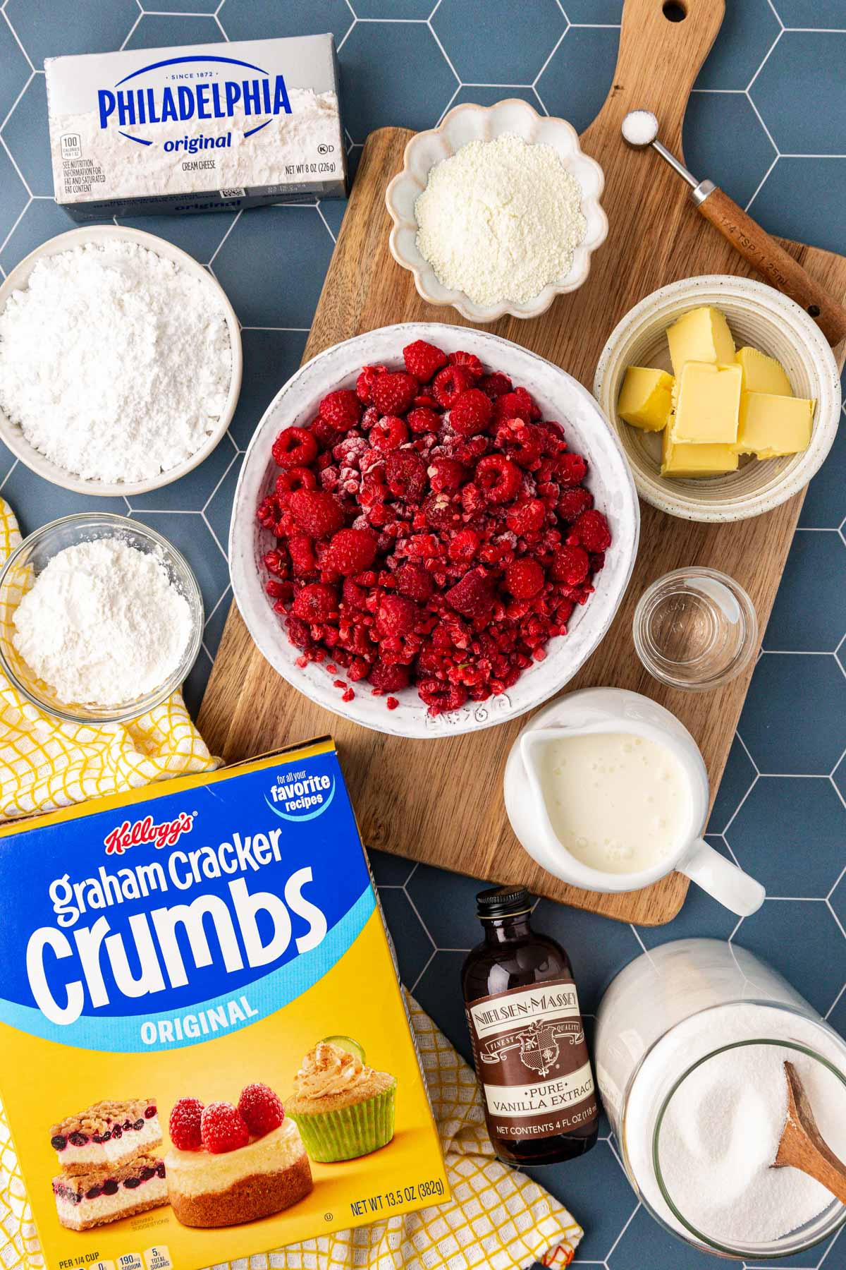 Overhead photo of ingredients to make raspberry cream pie on a wooden table.