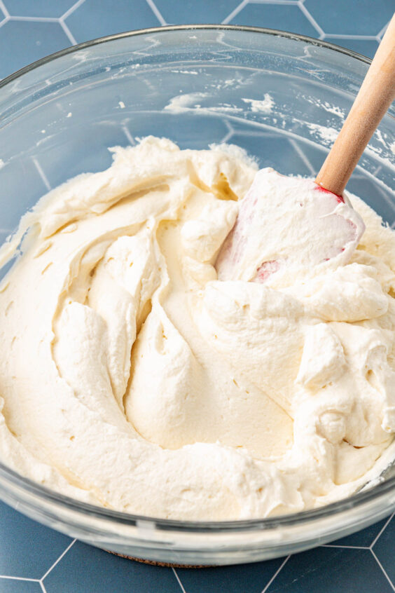 Cream filling for pie in a glass mixing bowl.