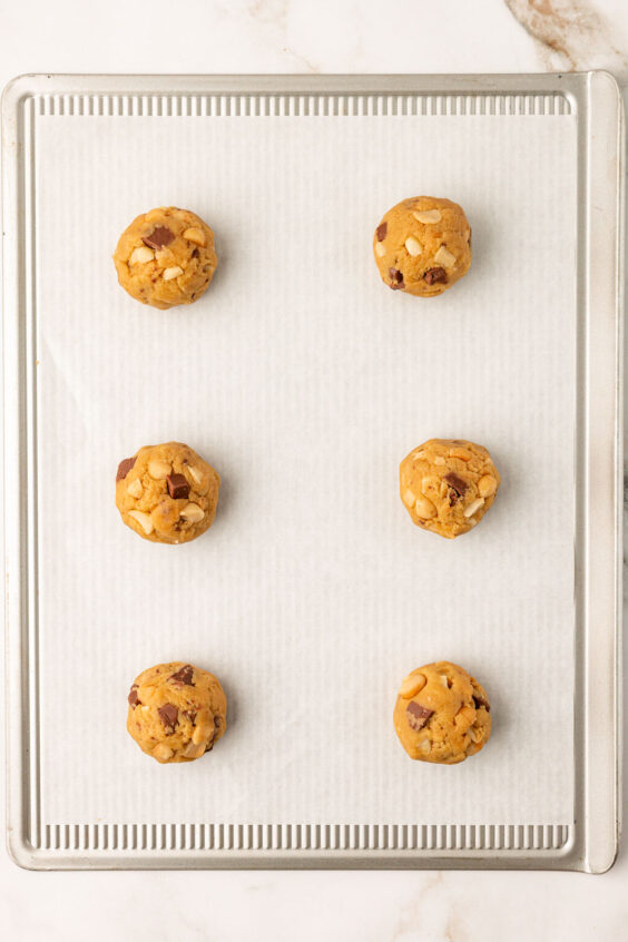 Overhead photo of Sausalito macadamia chocolate chip cookies on a sheet pan.