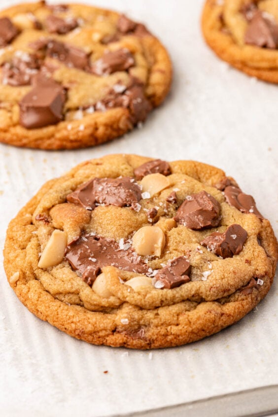 Macadamia Chocolate Chip Cookies on a sheet pan.