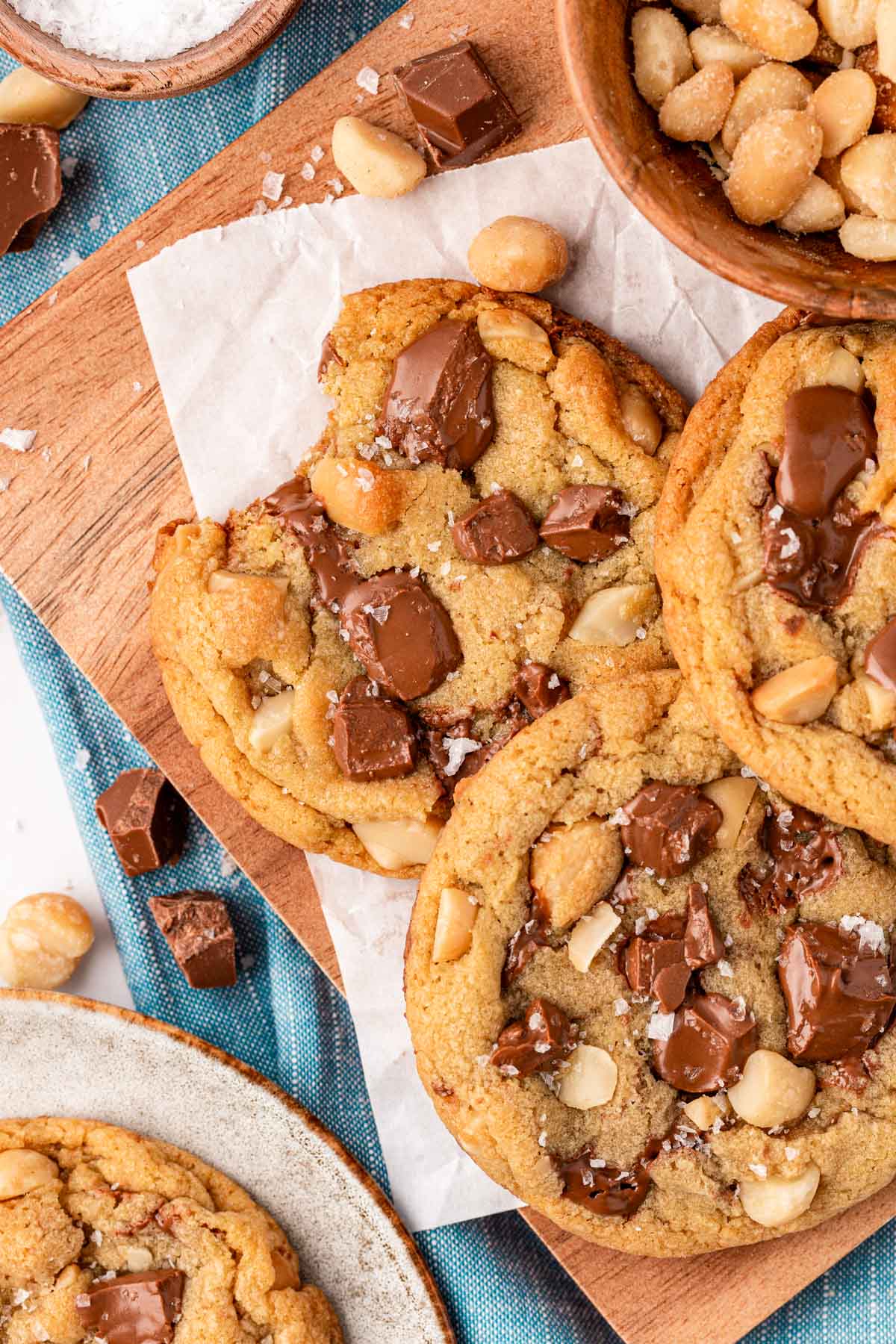 Overhead photo of a serving board covered in Sausalito macadamia chocolate chip cookies.