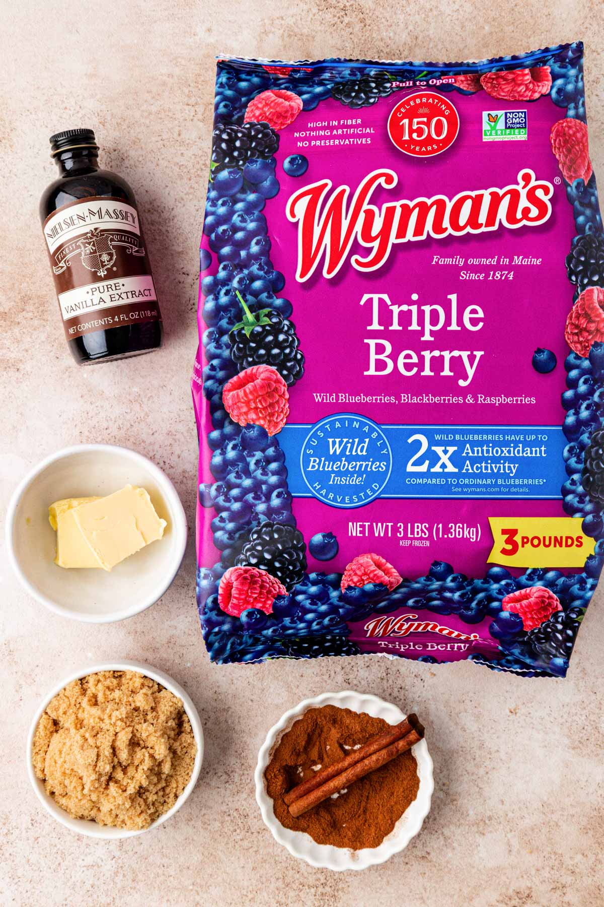 Overhead photo of ingredients to make mixed berry compote on a table.