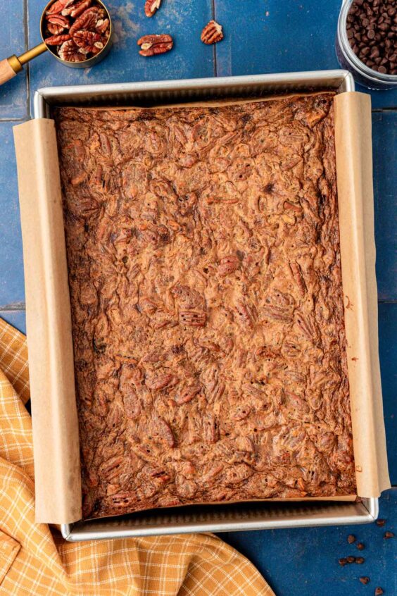 Overhead photo of pecan pie brownies in a pan.