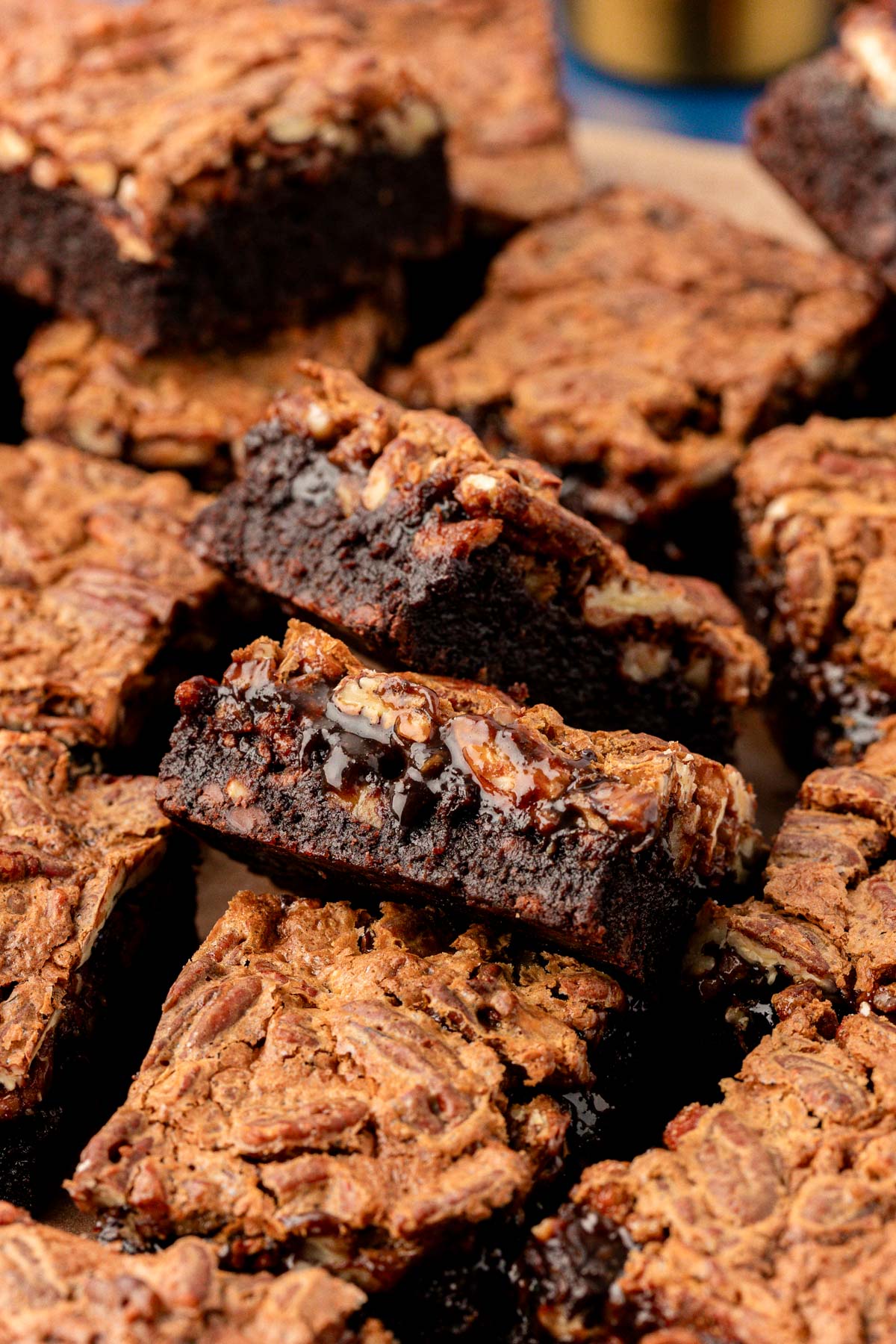 Pecan pie brownies cut up on a table.