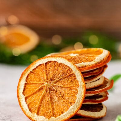 Dried orange slices stacked on a table.