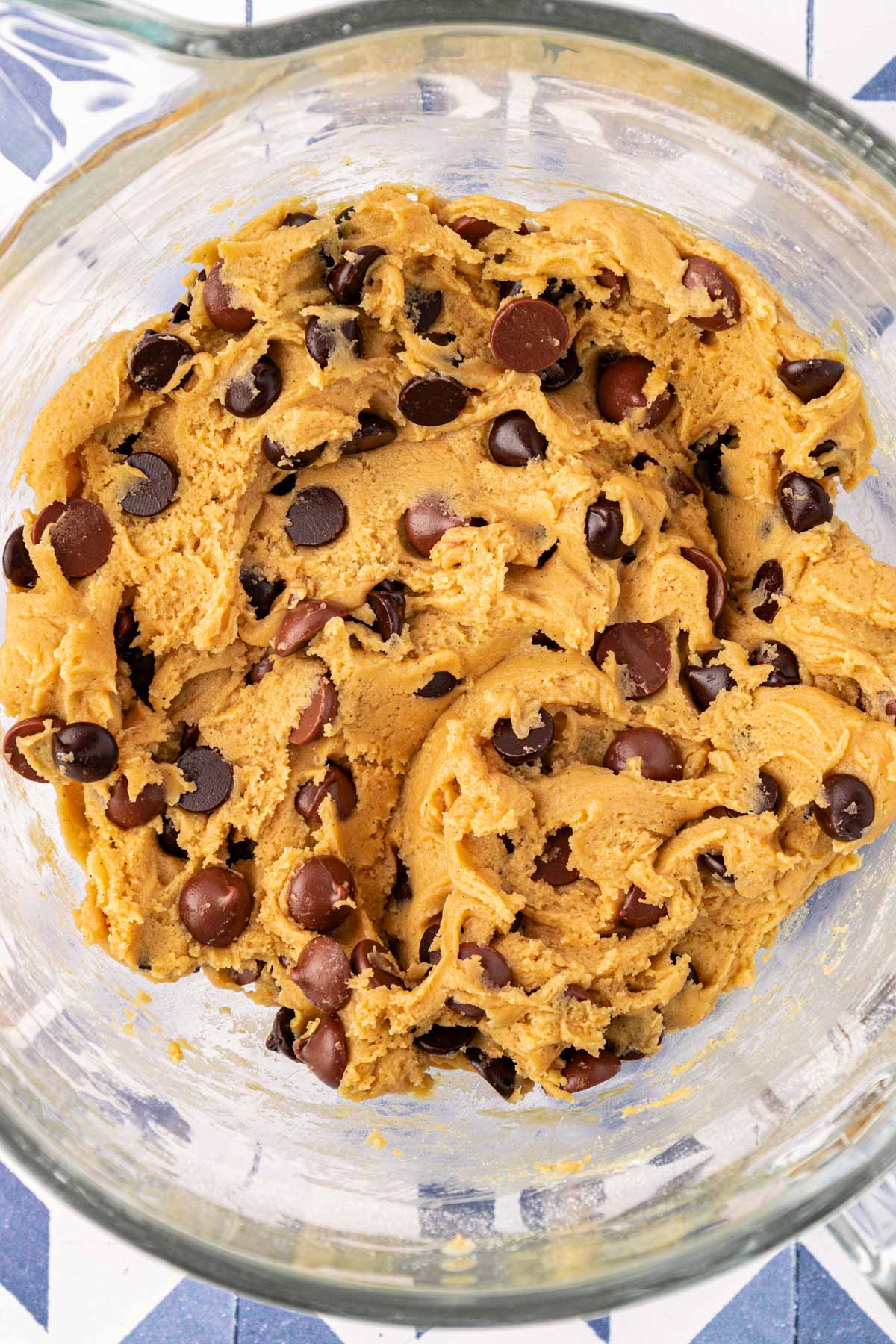 Chocolate chip cookie dough in a bowl.