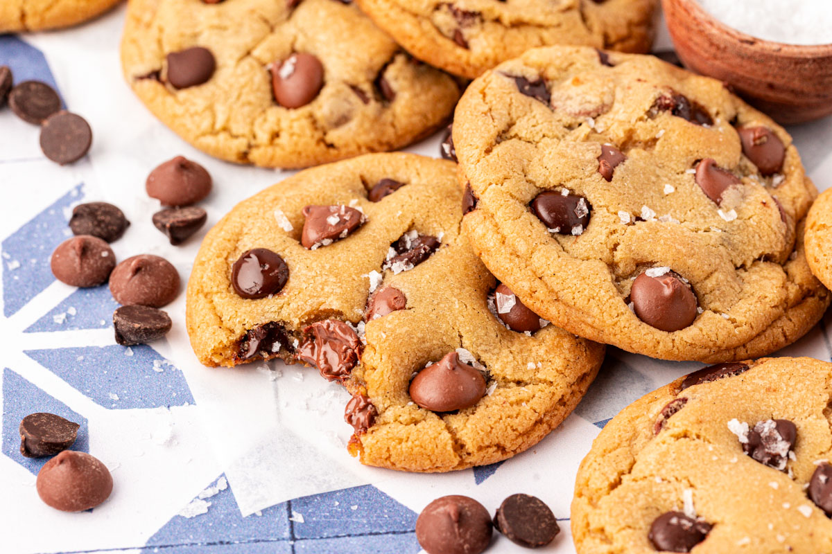 Close up of chewy chocolate chip cookies on a table.