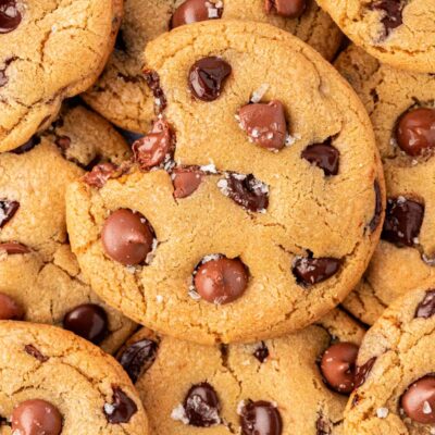 Close up of a plate of chocolate chip cookies with sea salt on them.