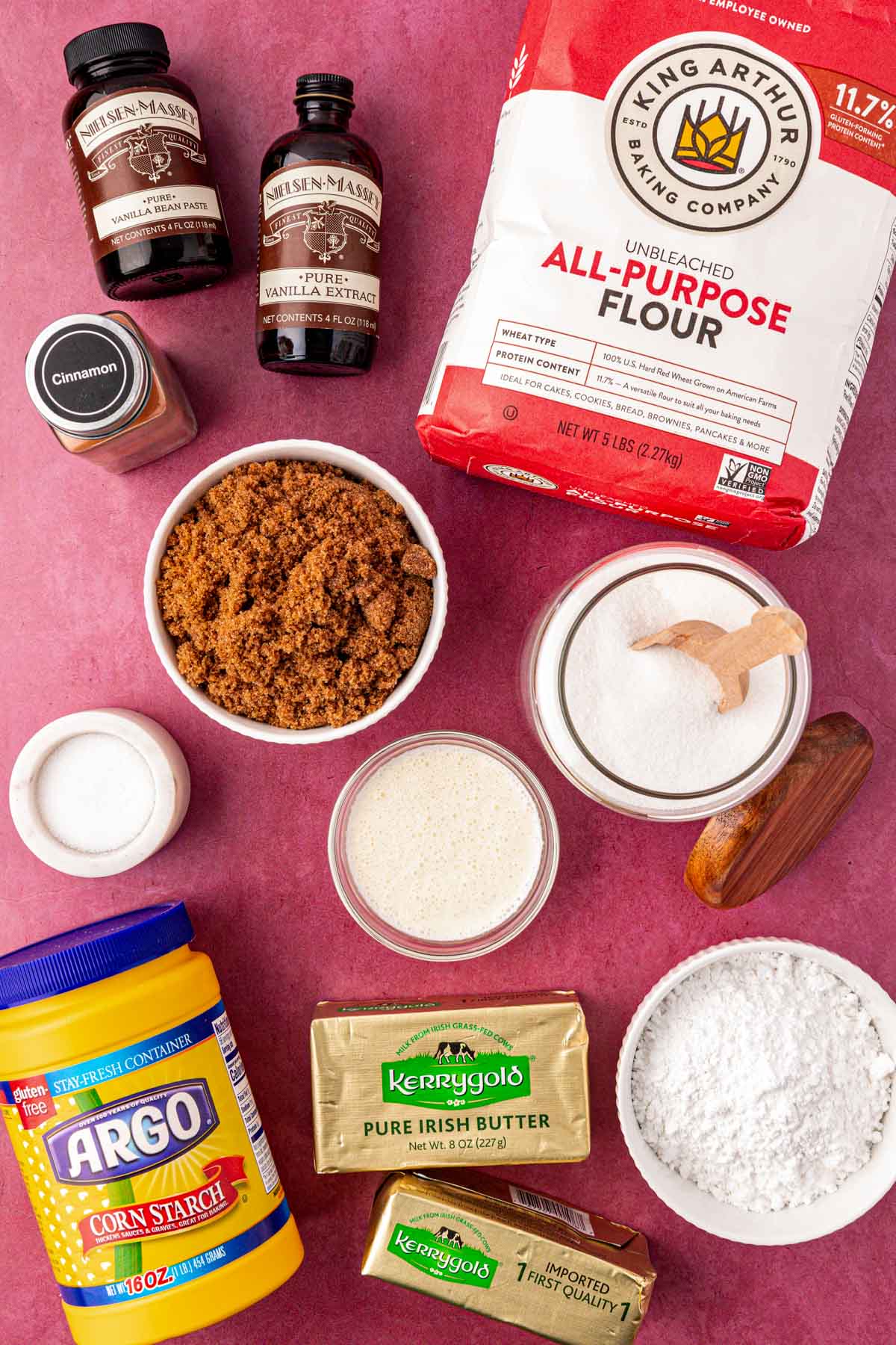 Overhead photo of ingredients to make shortbread cookie bars on a red table.