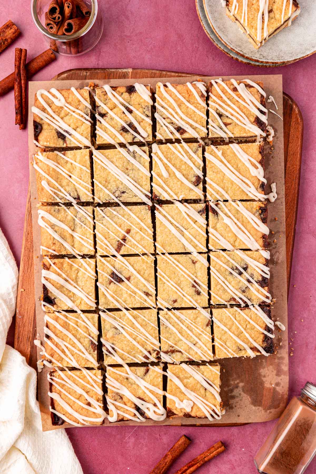 Overhead photo of shortbread bars cut up on a wooden board.