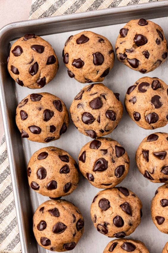 Overhead photo of balls of espresso chip dough on a pan.