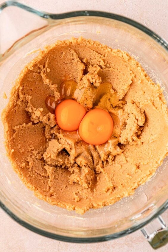 Eggs in a mixing bowl to make cookie dough.