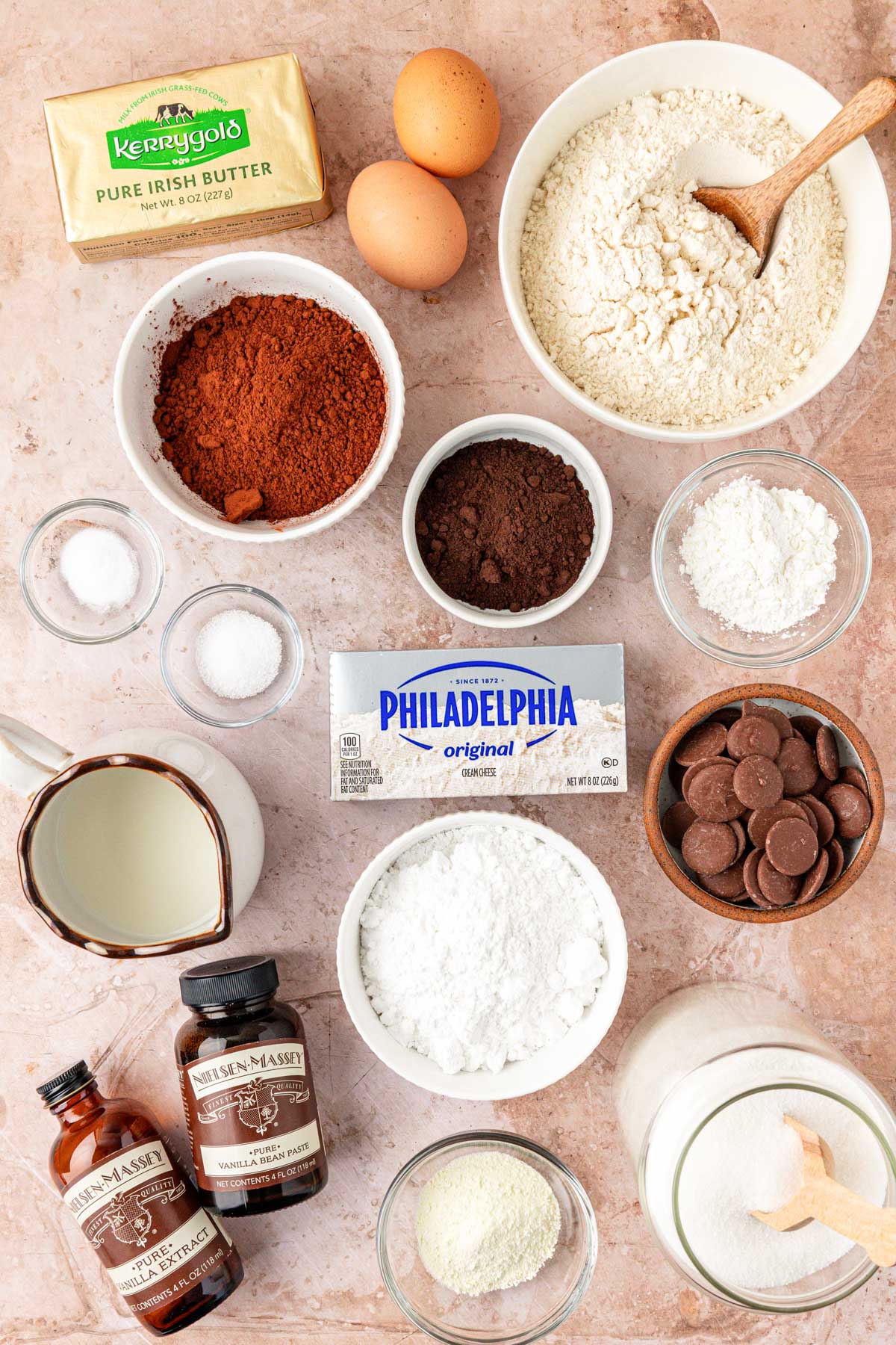 Overhead photo of ingredients to make chocolate cookies with cheesecake filling on a table.