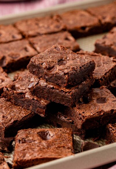 Stacks of brownies on a sheet pan.