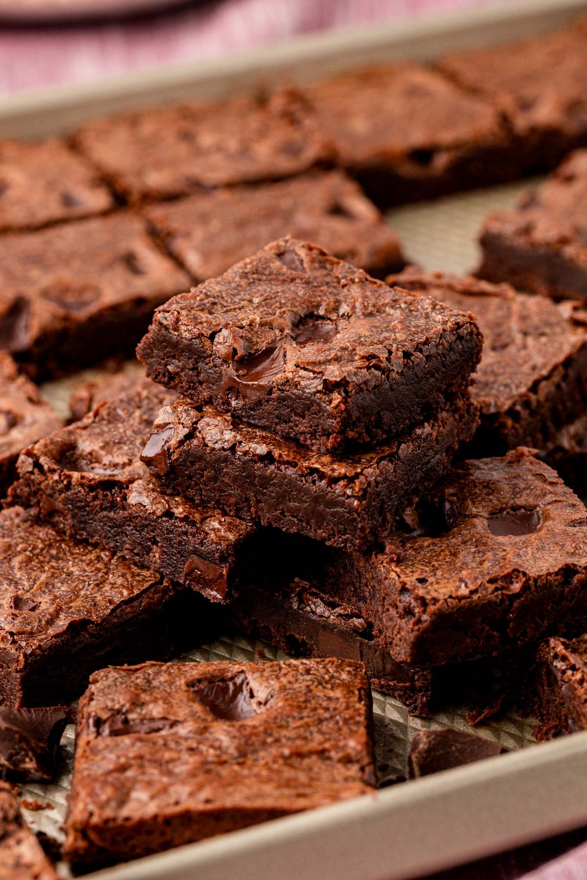 Stacks of brownies on a sheet pan.