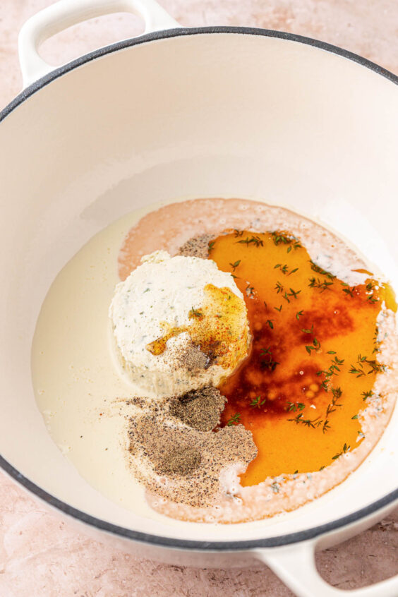 Cream and cheese and herbs in a pot with brown butter to make cream sauce.