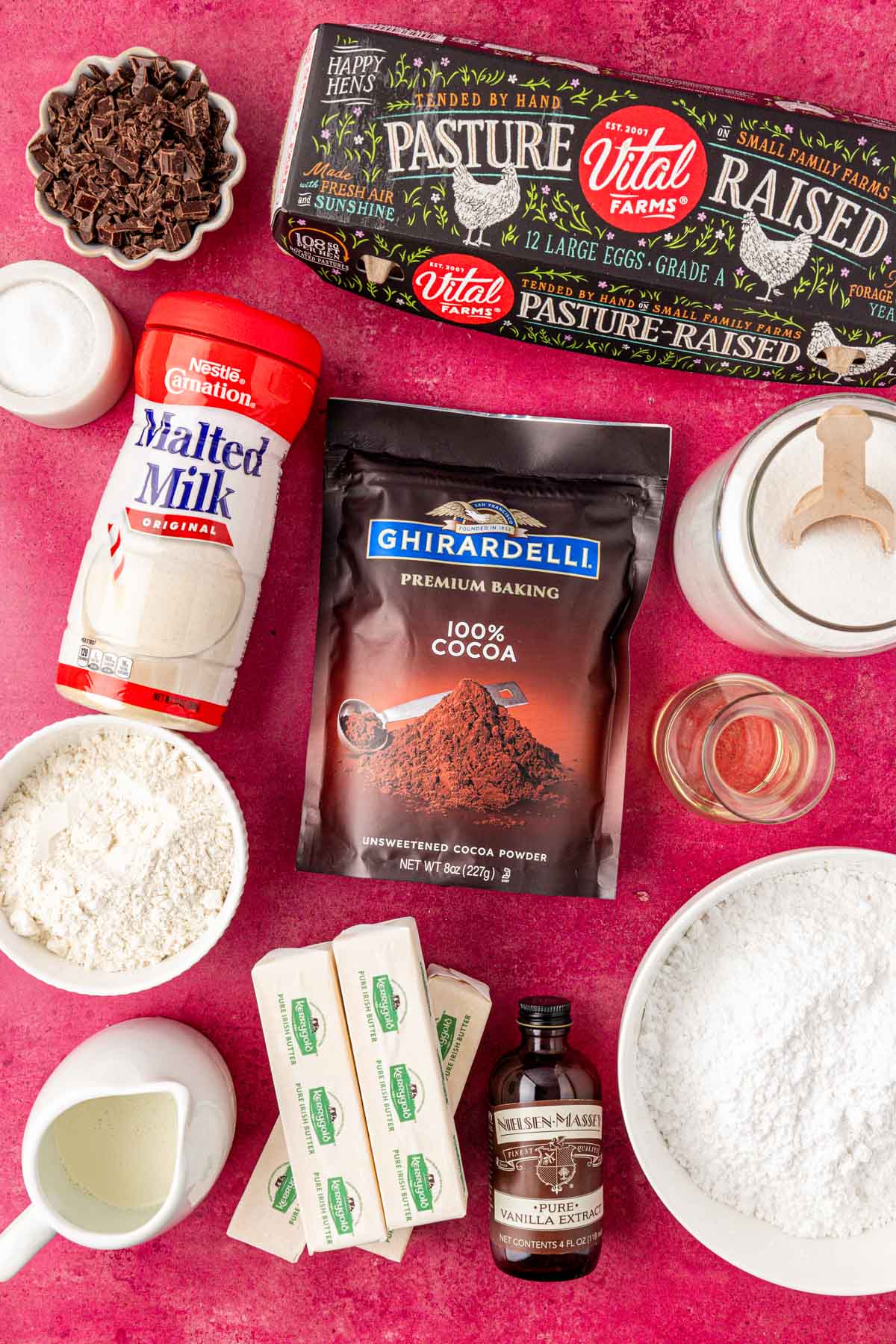 Ingredients to make brownies on a red table.