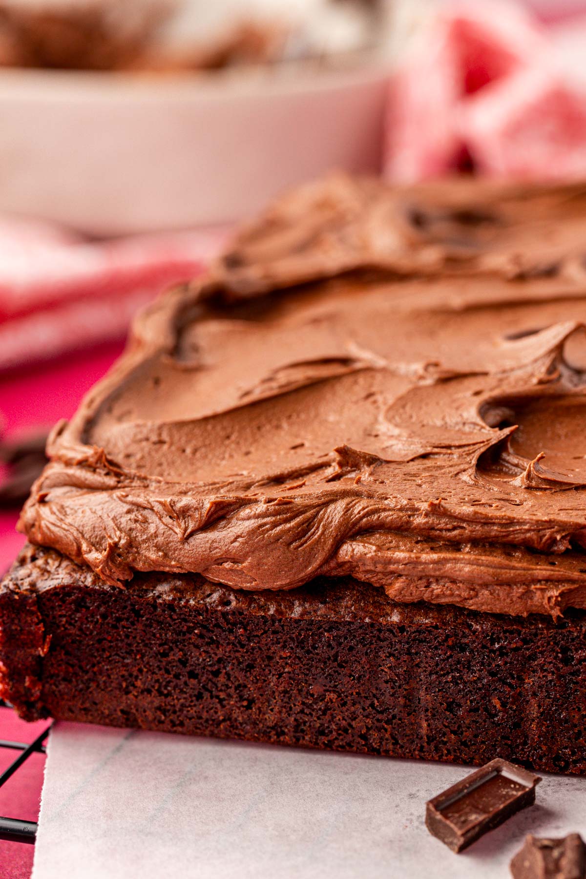 Close up of brownies with frosting on them.